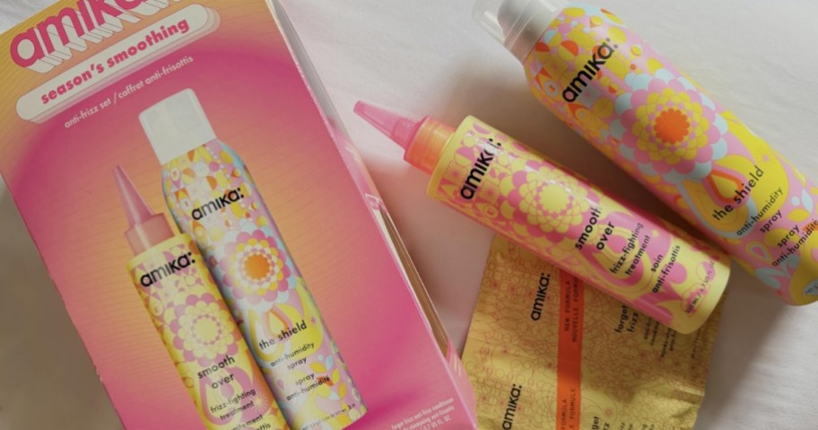 box for amika anti-frizz set with trial packs of shampoo and conditioner and full-size anti-frizz treatment bottles