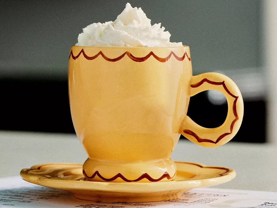 yellow mug with saucer