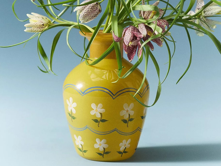 yellow floral vase with flowers 