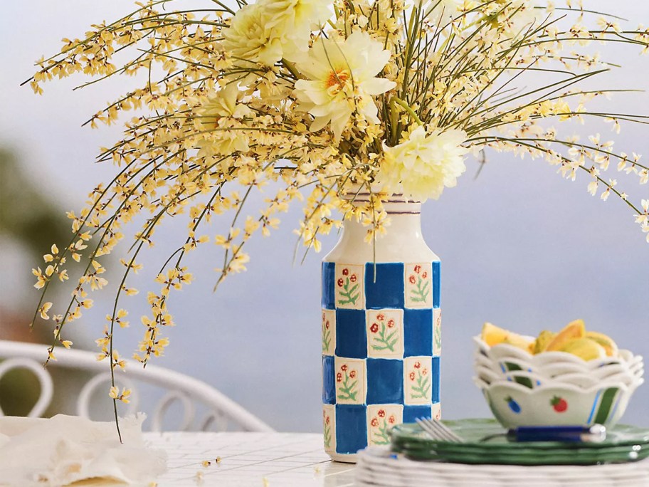 flower checkered vase on table