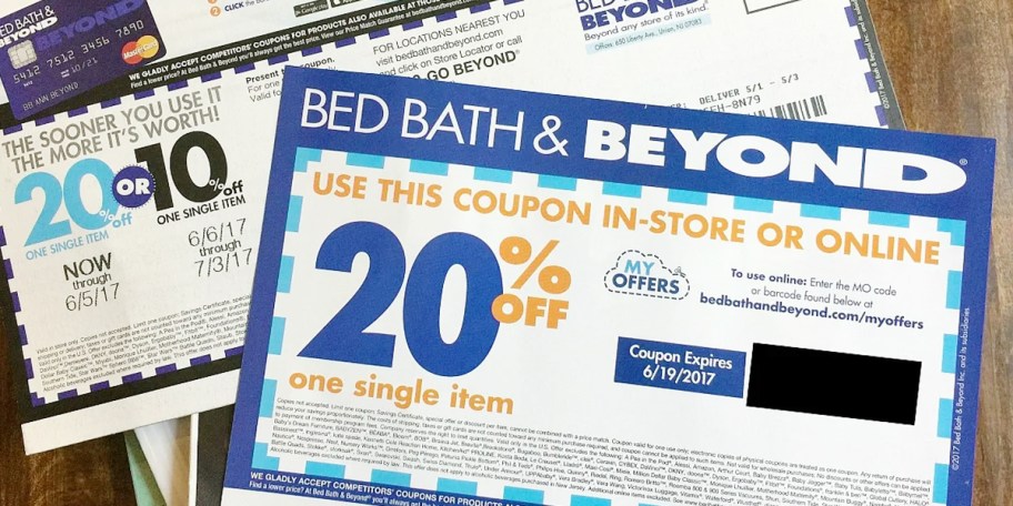 bed bath and beyond coupons stacked on table