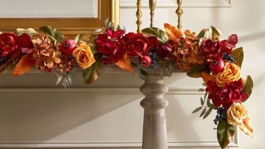 berry and flower garland displayed on a chimney