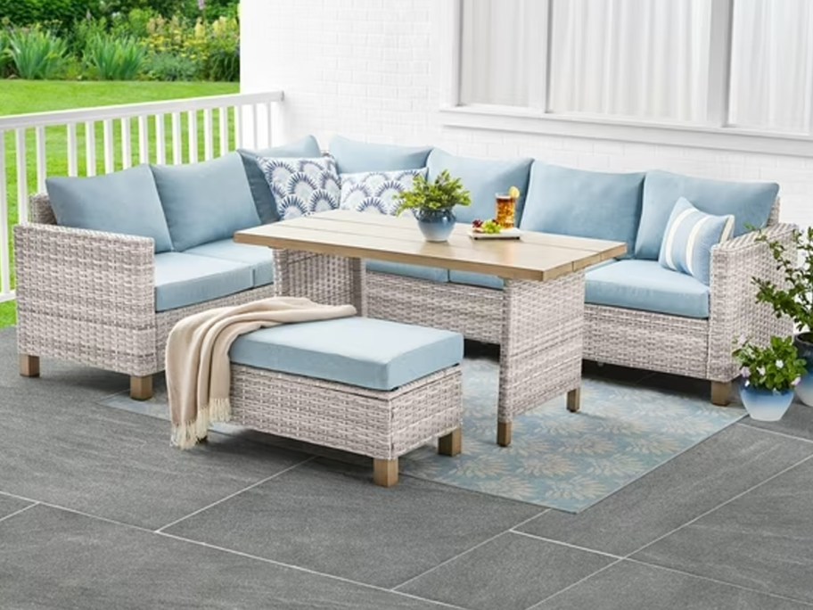 blue and gray sofa with table on patio 