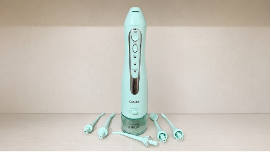 a min green water flosser shown with attachments