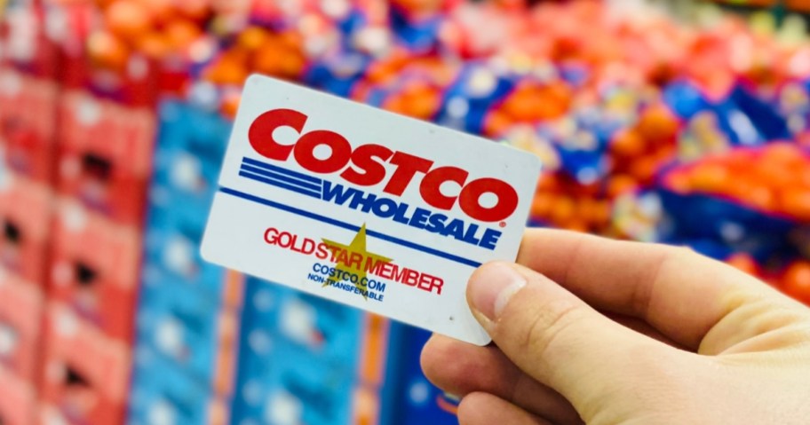 hand holding a Costco Membership card in store