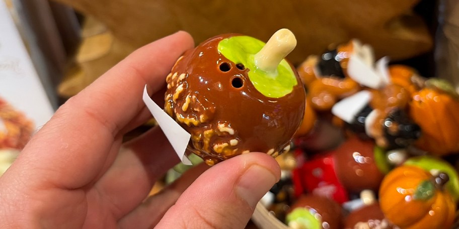 hand holding caramel apple salt shaker 