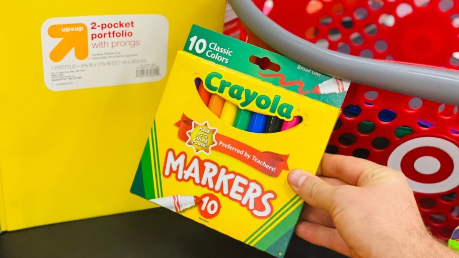 hand holding a 10 cpunt pack of crayola broad tip markers