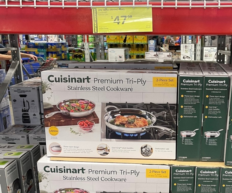 a stack of cusinart cookware sets in a store