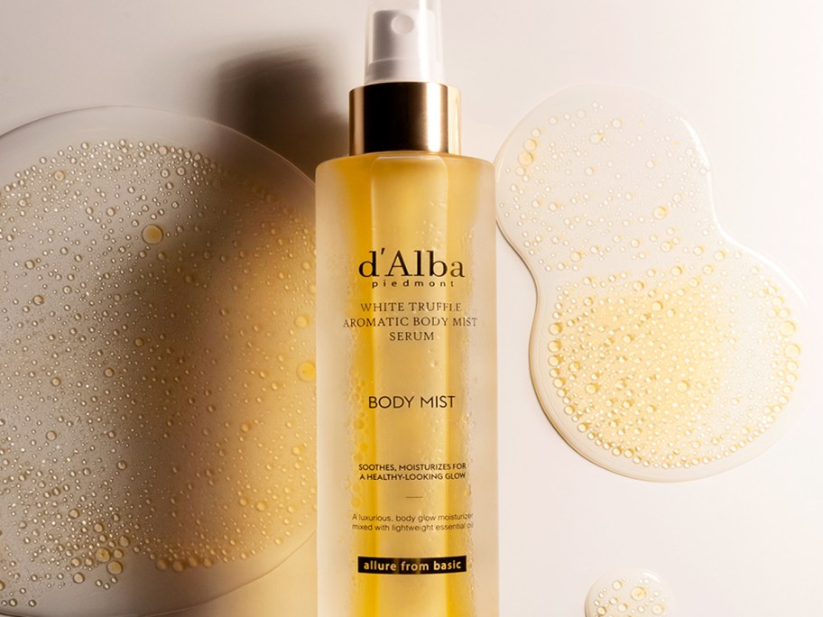 yellow bottle of d'Alba White Truffle Aromatic Body Mist Serum