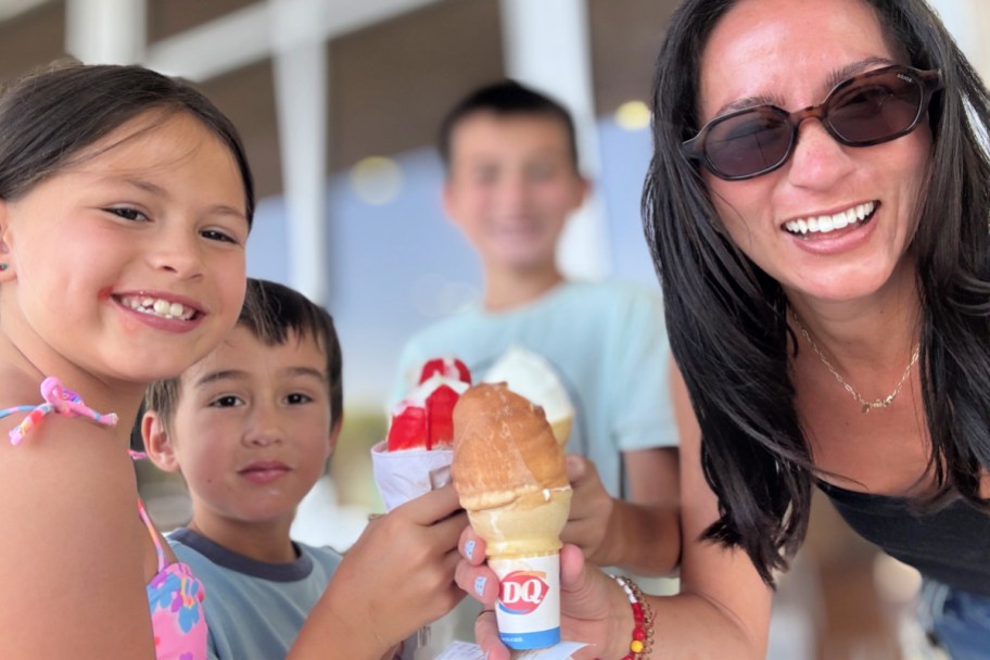 woman and kids holding dairy queen dipped cones