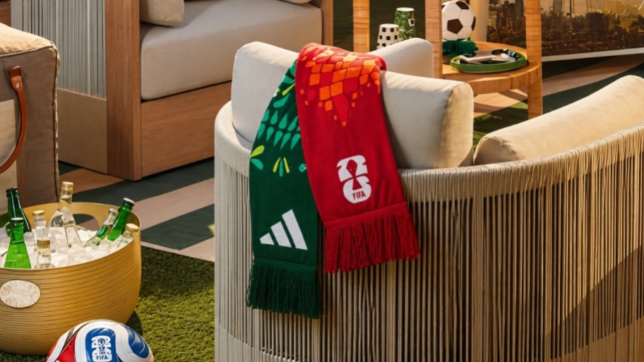 a scarf draped over the back of a patio chair