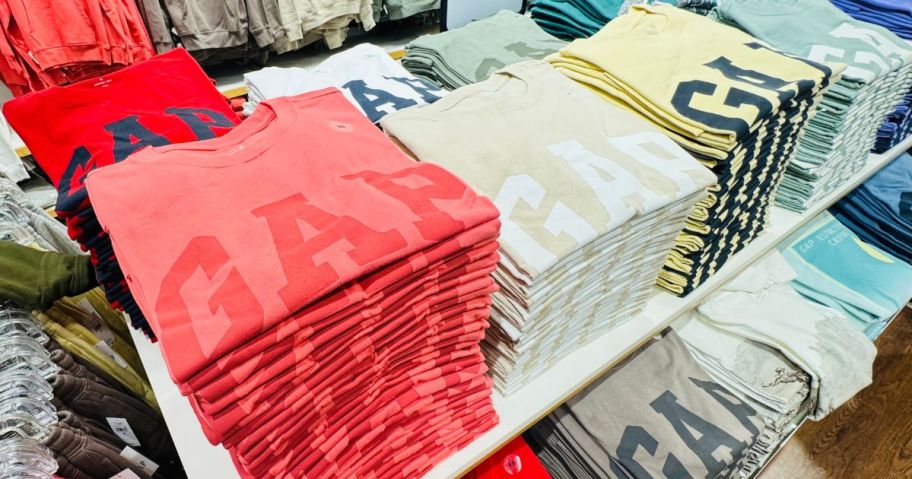 gap tops on table in store