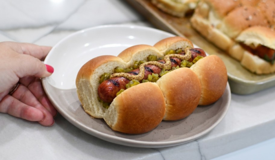 hot dog on three hawaiian roll buns