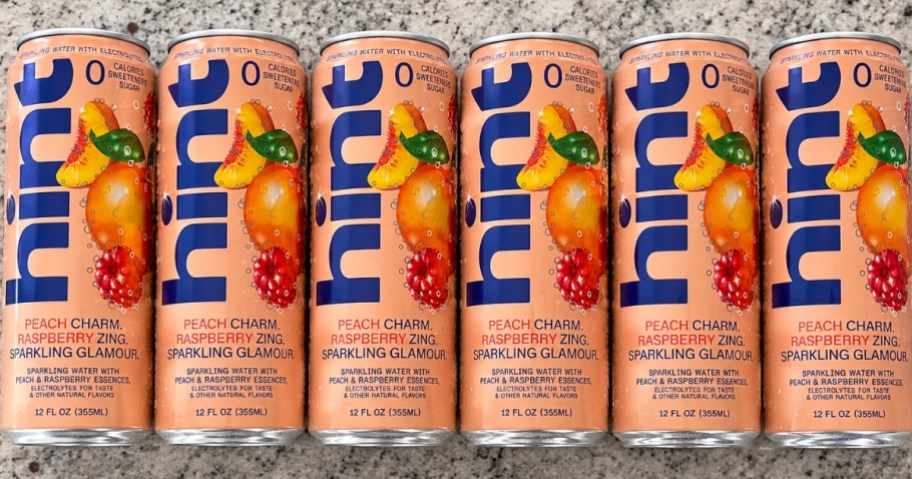 Cans of Hint Sparkling Peach & Raspberry Water on the counter