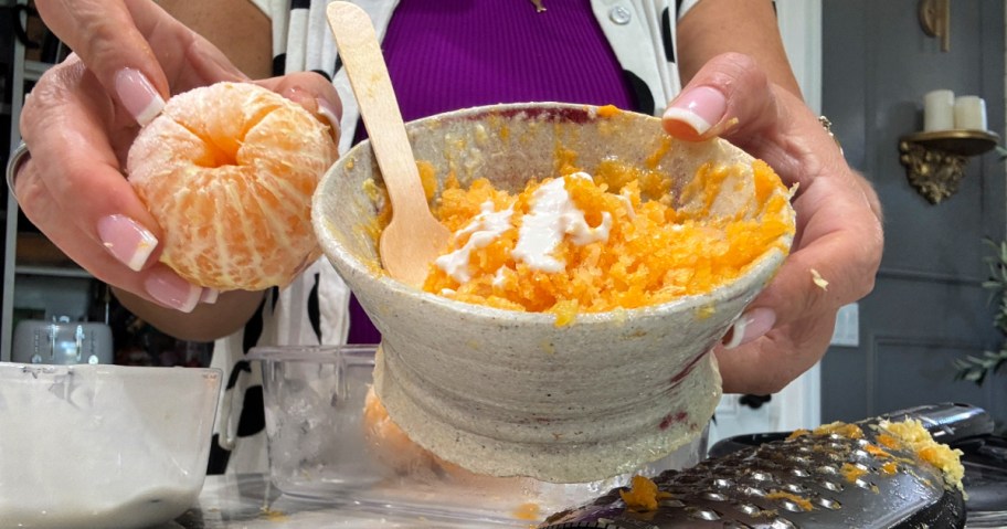 holding shaved mandarin oranges