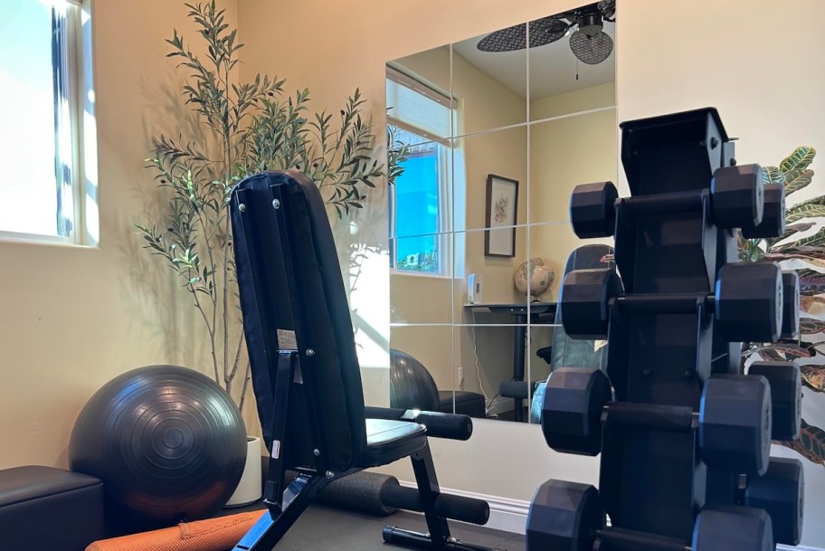 tile mirrors on home gym wall