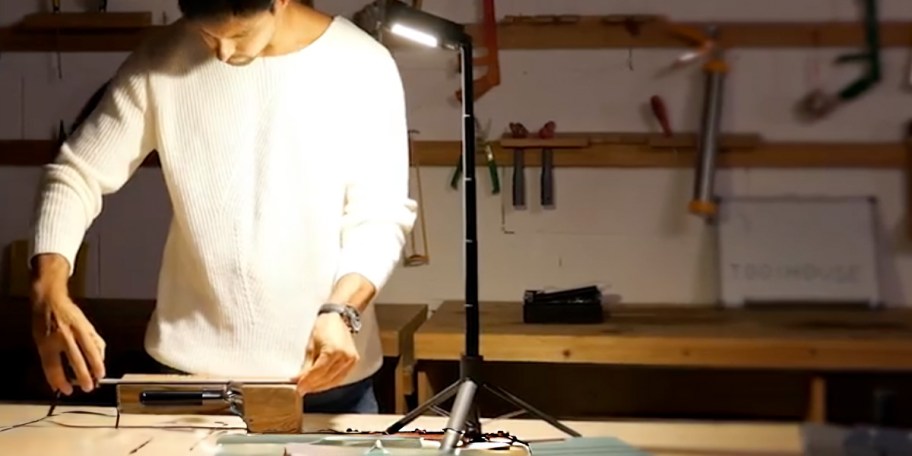 black tripod light on work table
