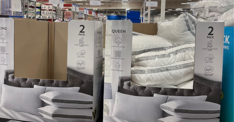 king and queen pillows on display in a store