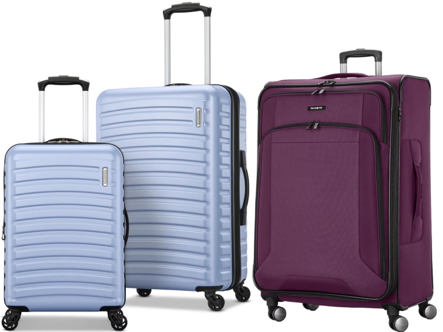 Three pieces of luggage, featuring two light blue hardside spinners of different sizes on the left and a deep purple softside spinner suitcase on the right.