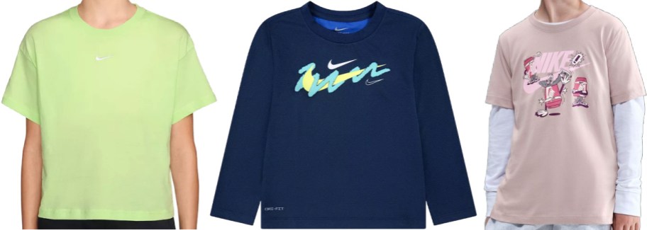 Three athletic shirts: a short-sleeved green crop top on the left, a long-sleeved navy blue shirt with a colorful graphic in the center, and a short-sleeved beige shirt with a graphic design on the right.