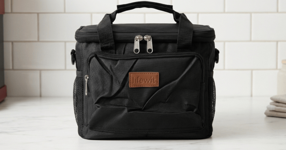black lunch bag on kitchen counter