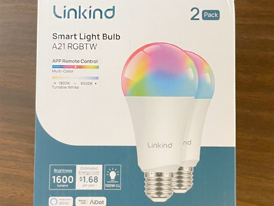 A pack of LinkedIn smart light bulbs sits on a table.