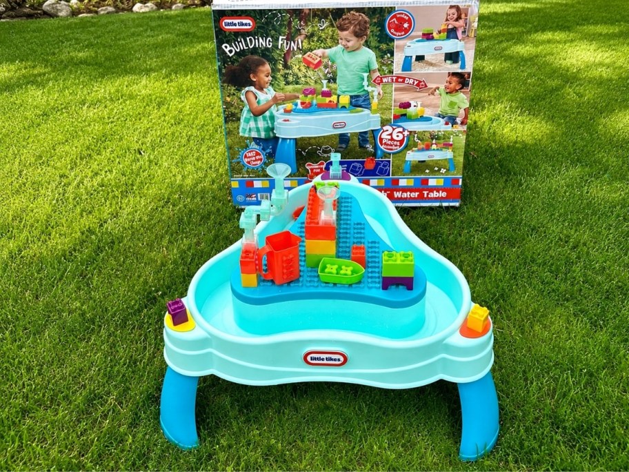little tike build and play water table outside in the grass
