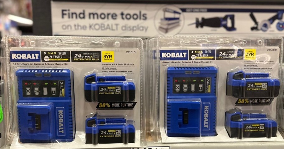 Two identical packages of Kobalt 24-volt lithium-ion battery and charger kits displayed on a store shelf.
