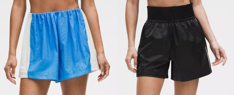 two women in blue and black shorts