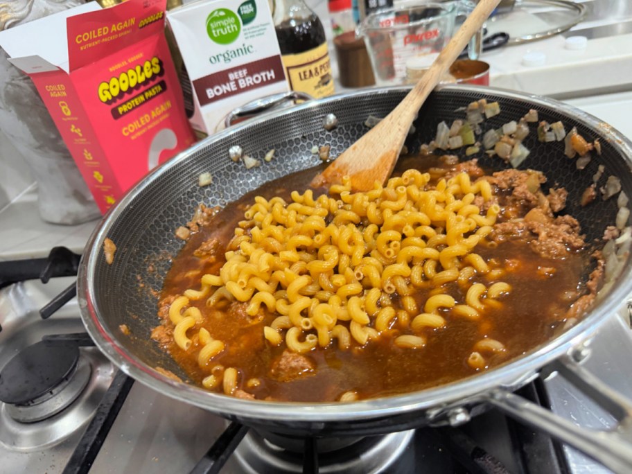 making hamburger helper in a skillet with goodles