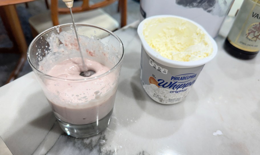 making homemade cold foam in a cup with cream and milk (1)