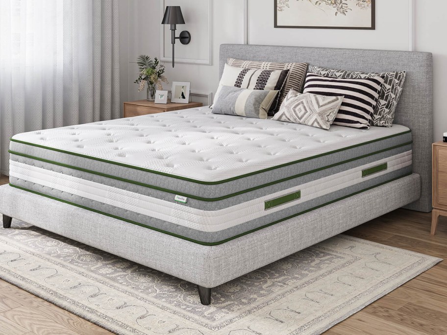 mattress on gray bed frame 