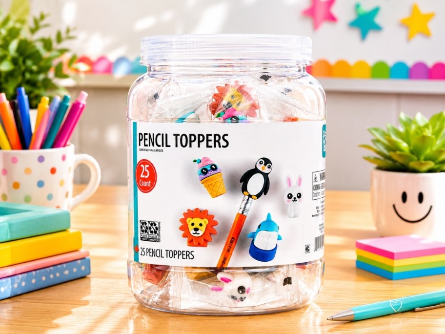 a bucket of pencil toppers on a desk in a classroom