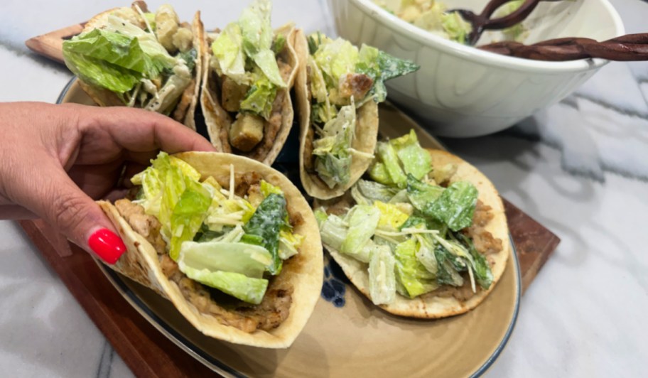 plate with caesar salad smashed tacos