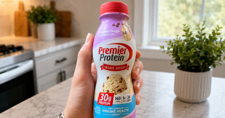 person holding a premier protein shake