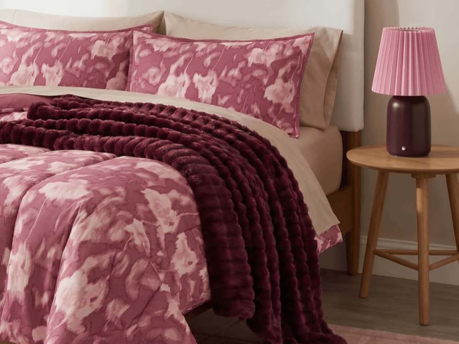 pink bedding on a bed