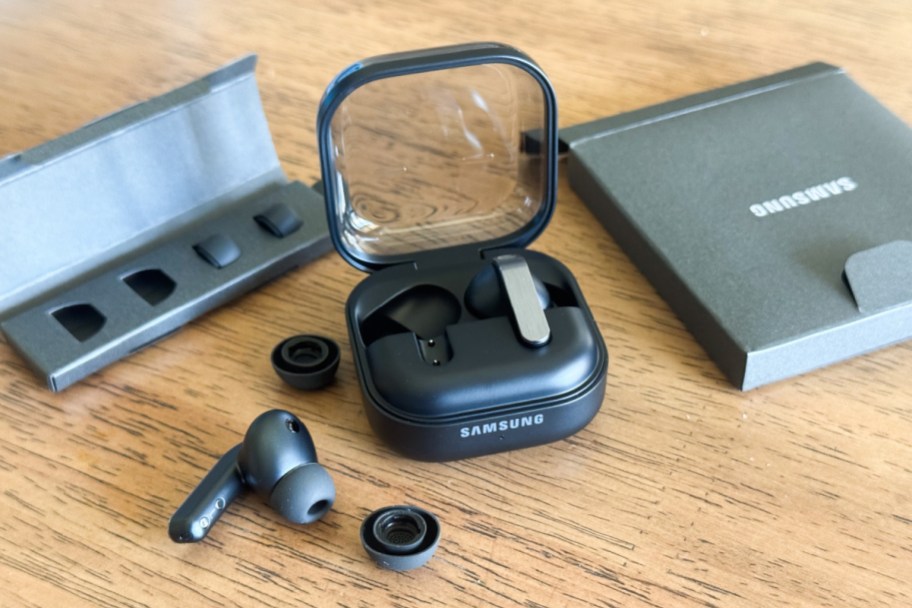 black earbuds open with charging case