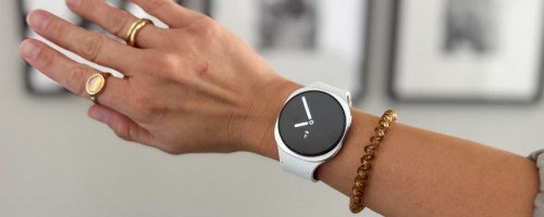 arm wearing white smart watch