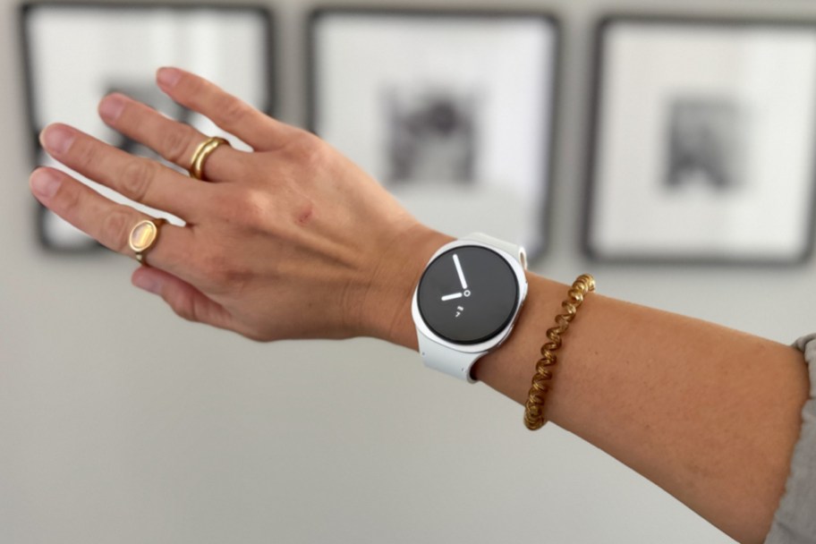 arm wearing white smart watch