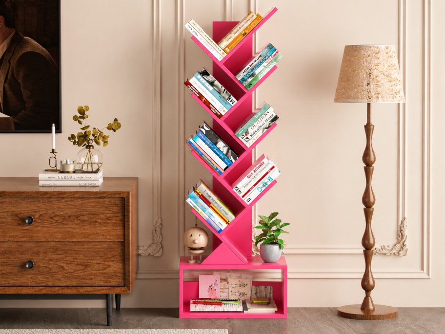 pink tree bookshelf full of books 