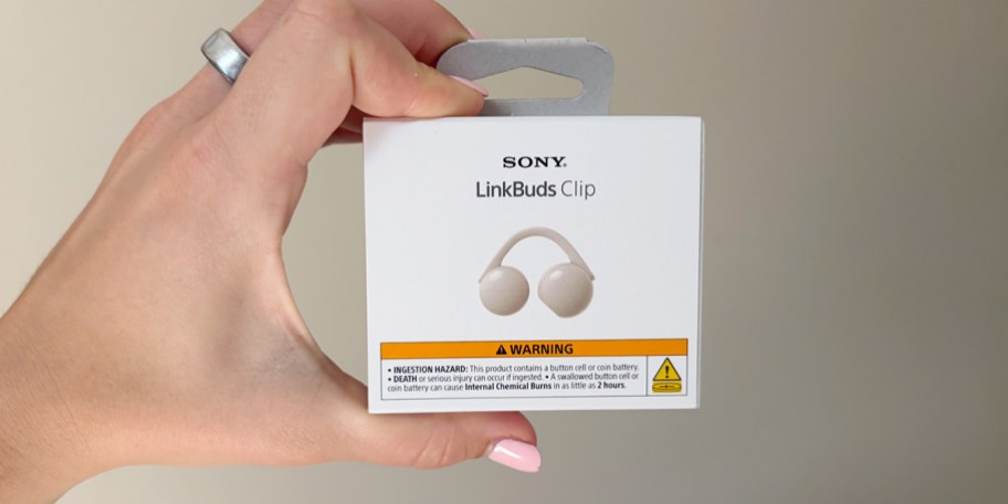 hand holding sony earbuds