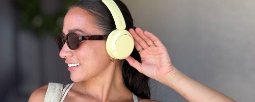 woman wearing yellow sony headphones