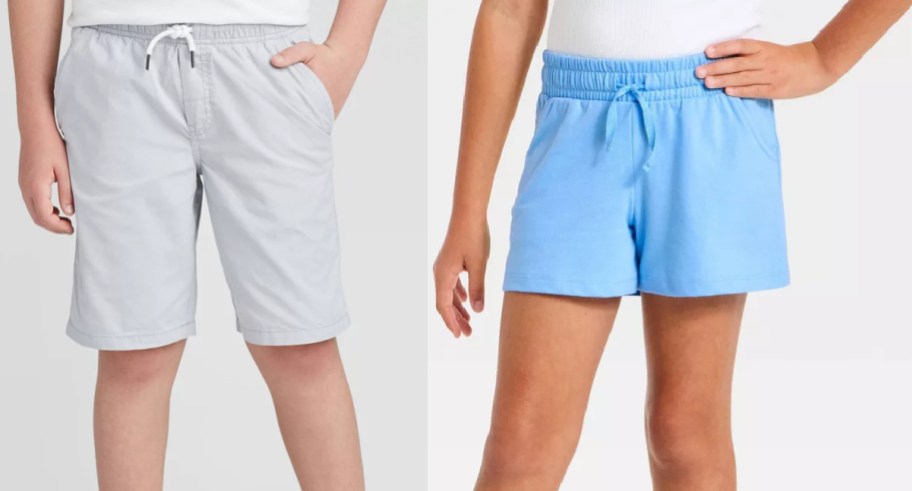 Two styles of children's Cat & Jack shorts displayed side by side, featuring light grey drawstring shorts on the left and bright blue elastic-waist shorts on the right.