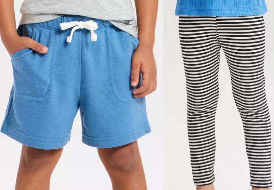 Two styles of children's Cat & Jack clothing displayed side by side, featuring blue pull-on shorts with a white drawstring on the left and black and white striped leggings on the right.