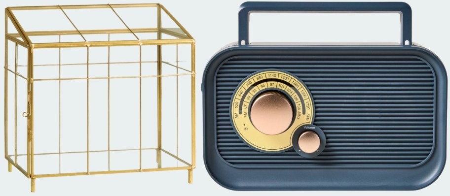 small brass and glass greenhouse and a blue radio