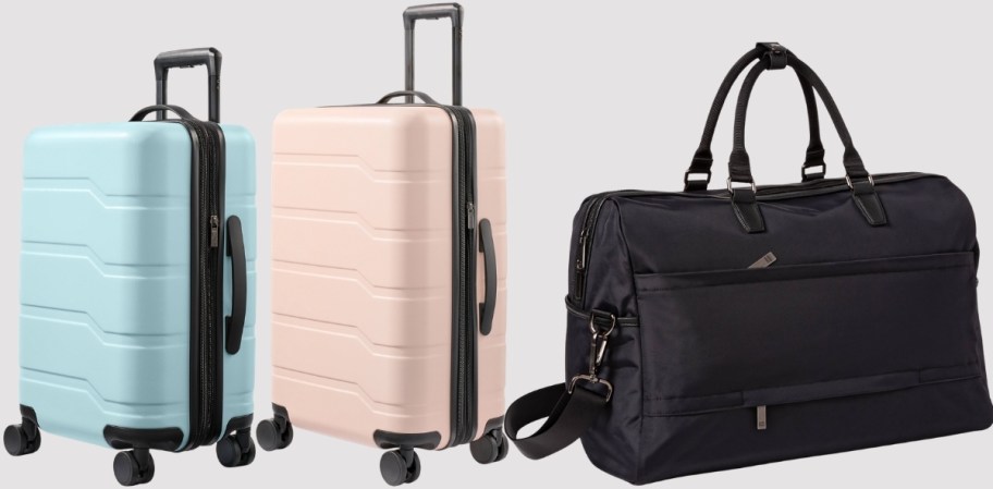 2 open story spinner suitcases and a large weekend bag