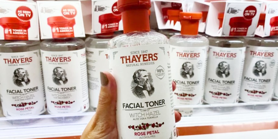 hand holding thayer facial toner bottle
