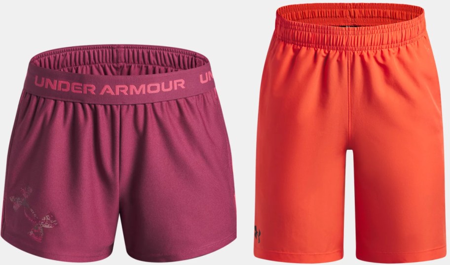 Two pairs of Under Armour shorts: one in purple and the other in orange.