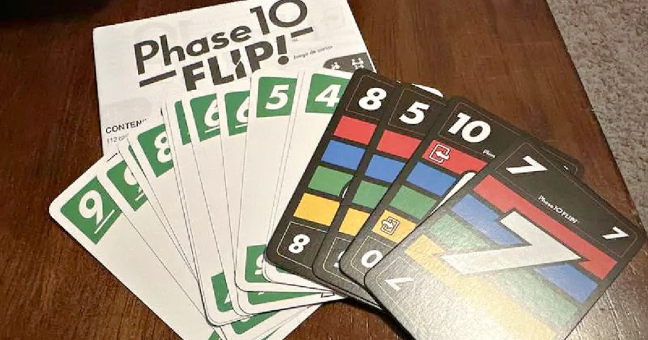 A display of Phase 10 Flip! game cards, including numbered cards and a game instruction sheet.