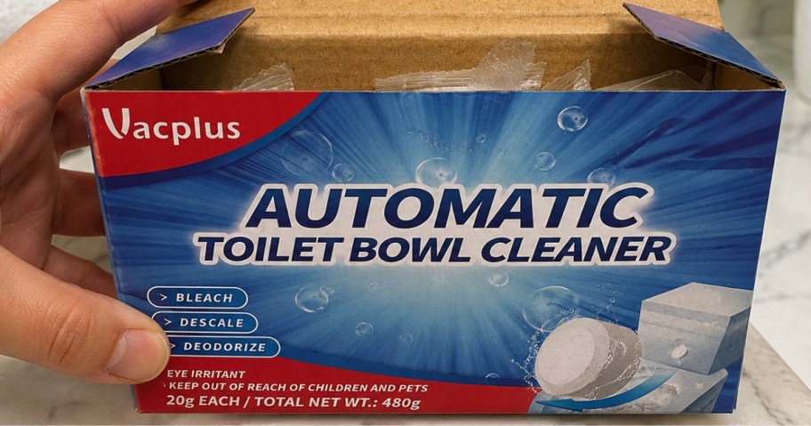 hand holding a box of toilet bowl cleaner tablets